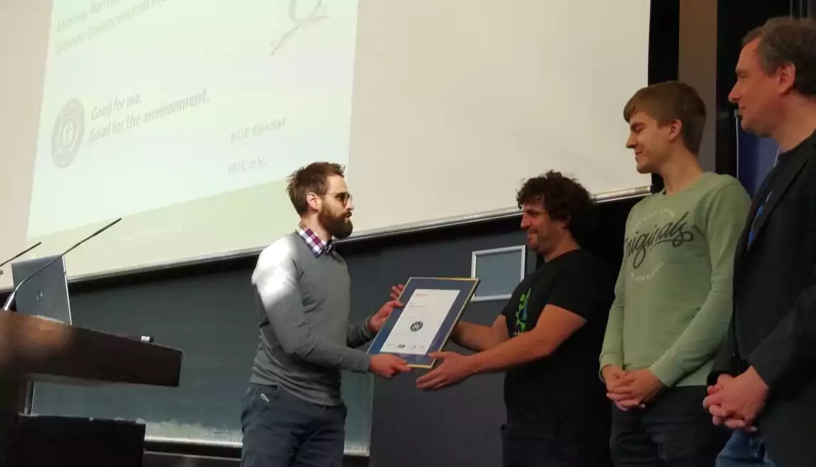 Joseph, Harri, and Alexander on stage at the Blue Angel award ceremony.